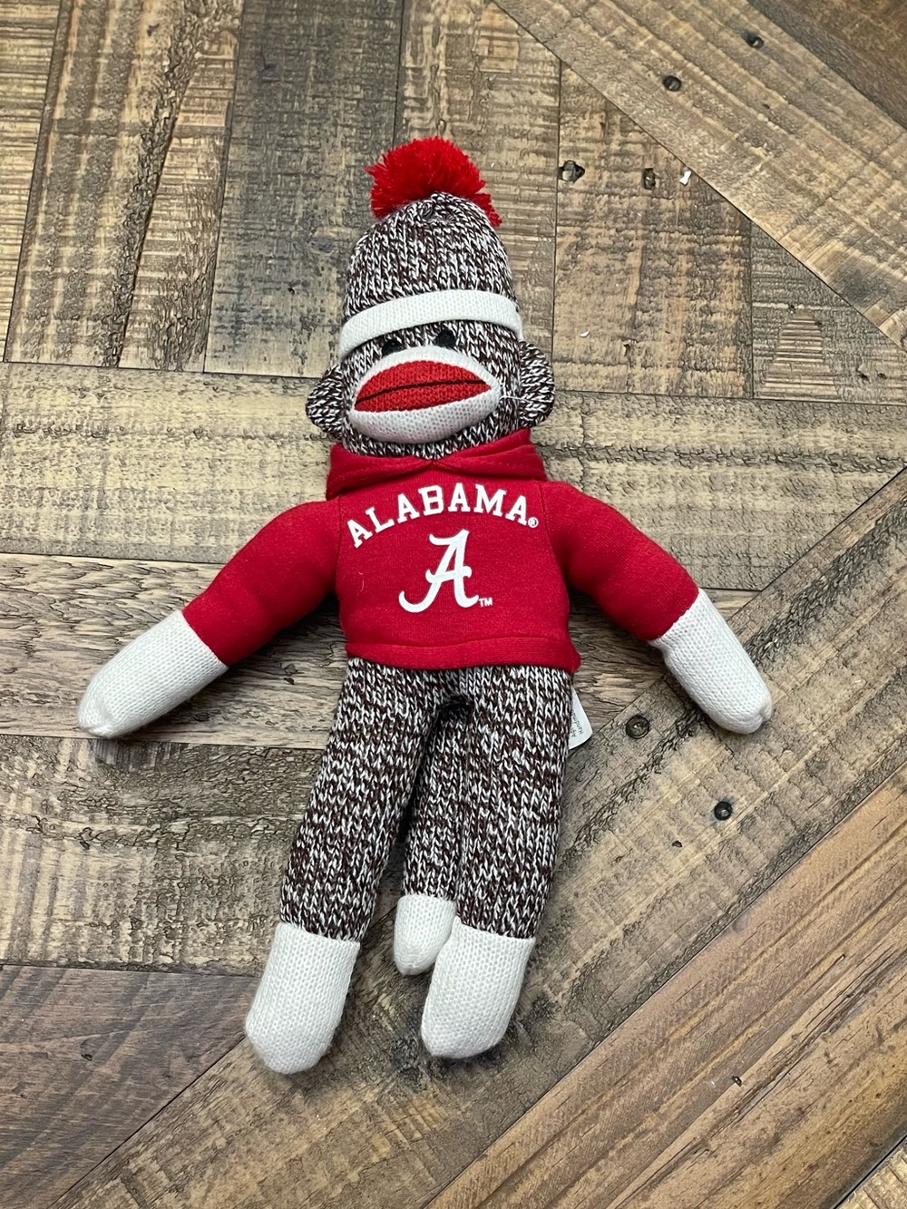 collegiate-themed Plushland Alabama Crimson Tide sock monkey plush toy
